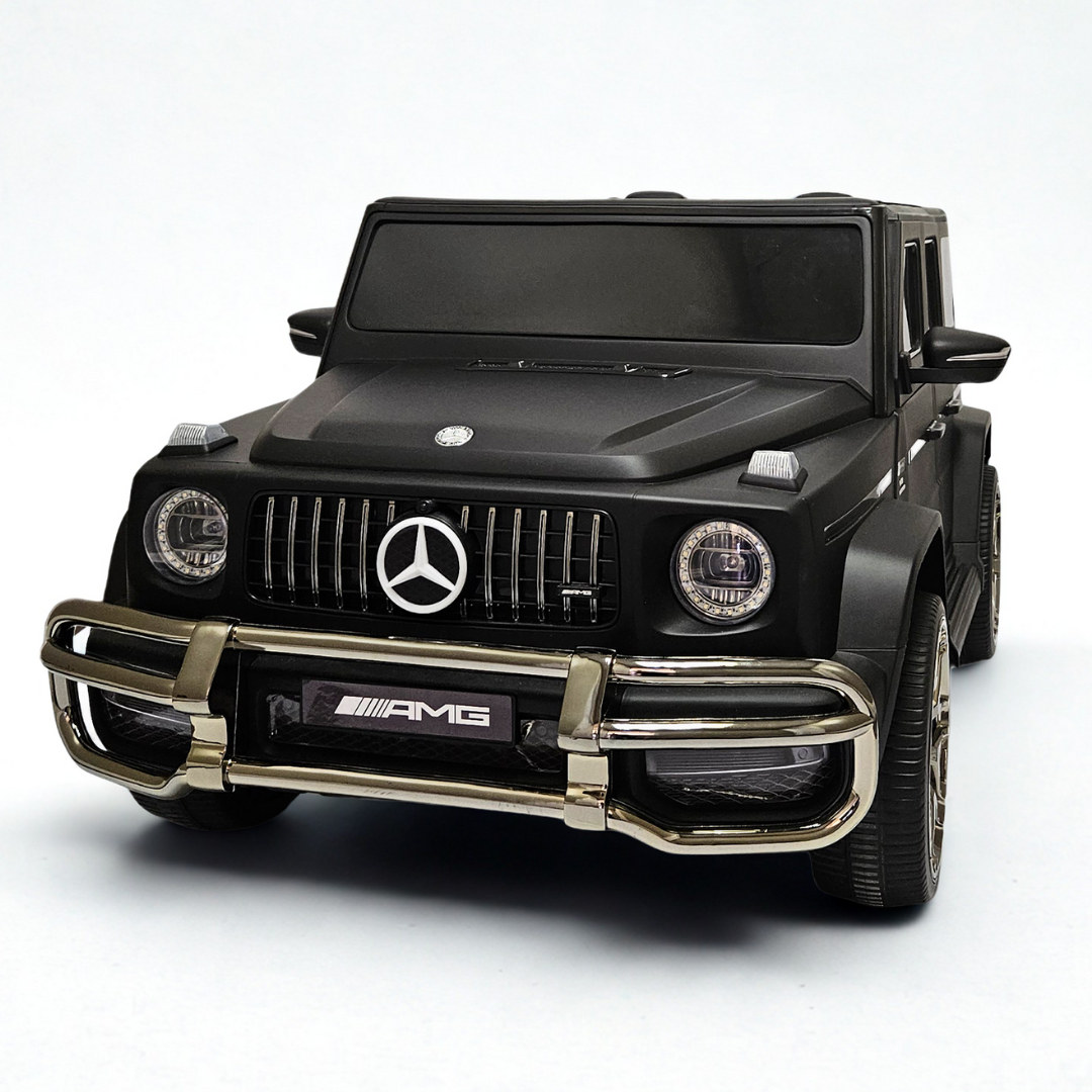 24V Mercedes Benz AMG G63 Exclusive 4x4 2-Seater Ride-On SUV W/ Rubber Wheels, Music Player, Floor Mat & RC