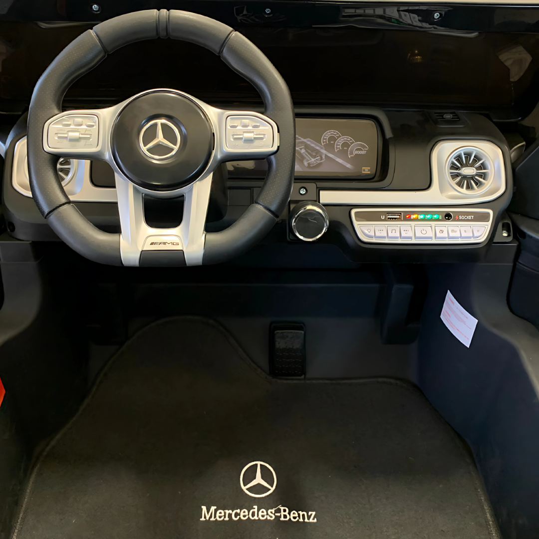 24V Mercedes Benz AMG G63 Exclusive 4x4 2-Seater Ride-On SUV W/ Rubber Wheels, Music Player, Floor Mat & RC