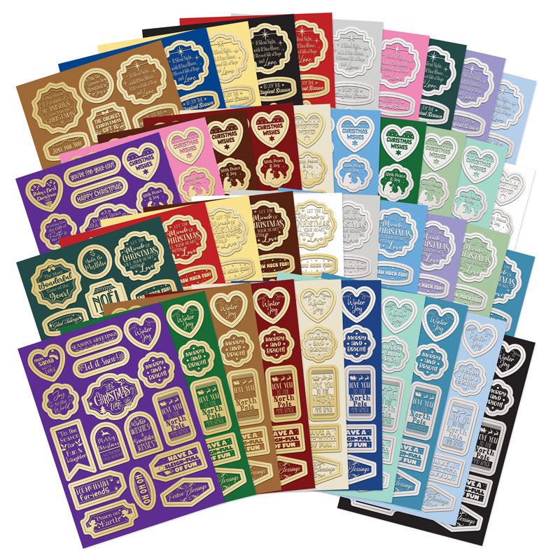Essential Book Of Christmas Sentiments 2024 die-cut sentiments in festive colors and foil designs, perfect for holiday crafting.