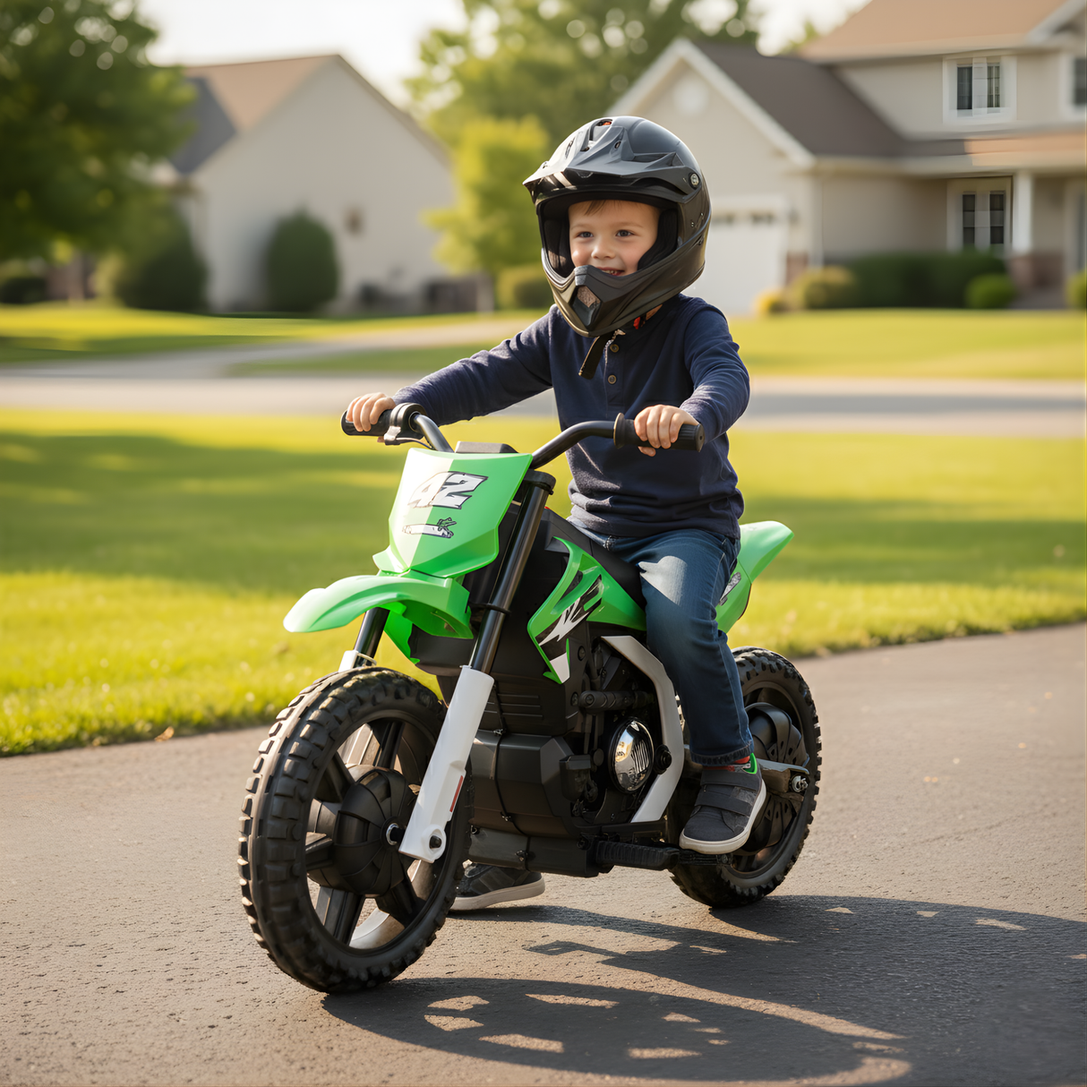 A child riding a 24V kids electric dirt bike, wearing a helmet, enjoying the outdoors on a sunny day.