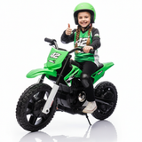 Happy girl giving a thumbs up while riding a green 24V kids electric dirt bike wearing a helmet and motocross gear.