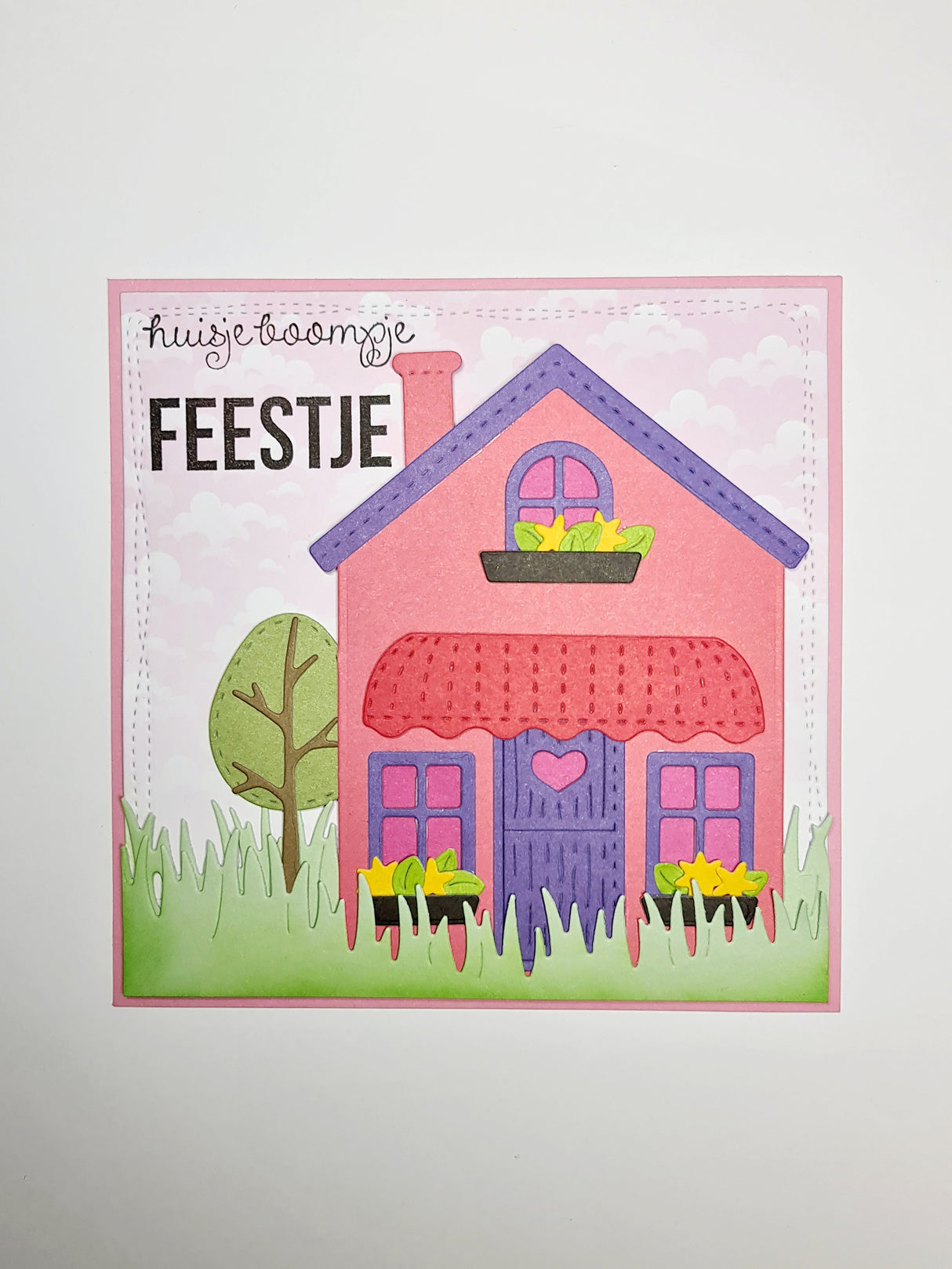 CCL Cutting Die Borderz Grass Essentials 2 PC crafted card featuring a colorful house design and decorative grass borders.